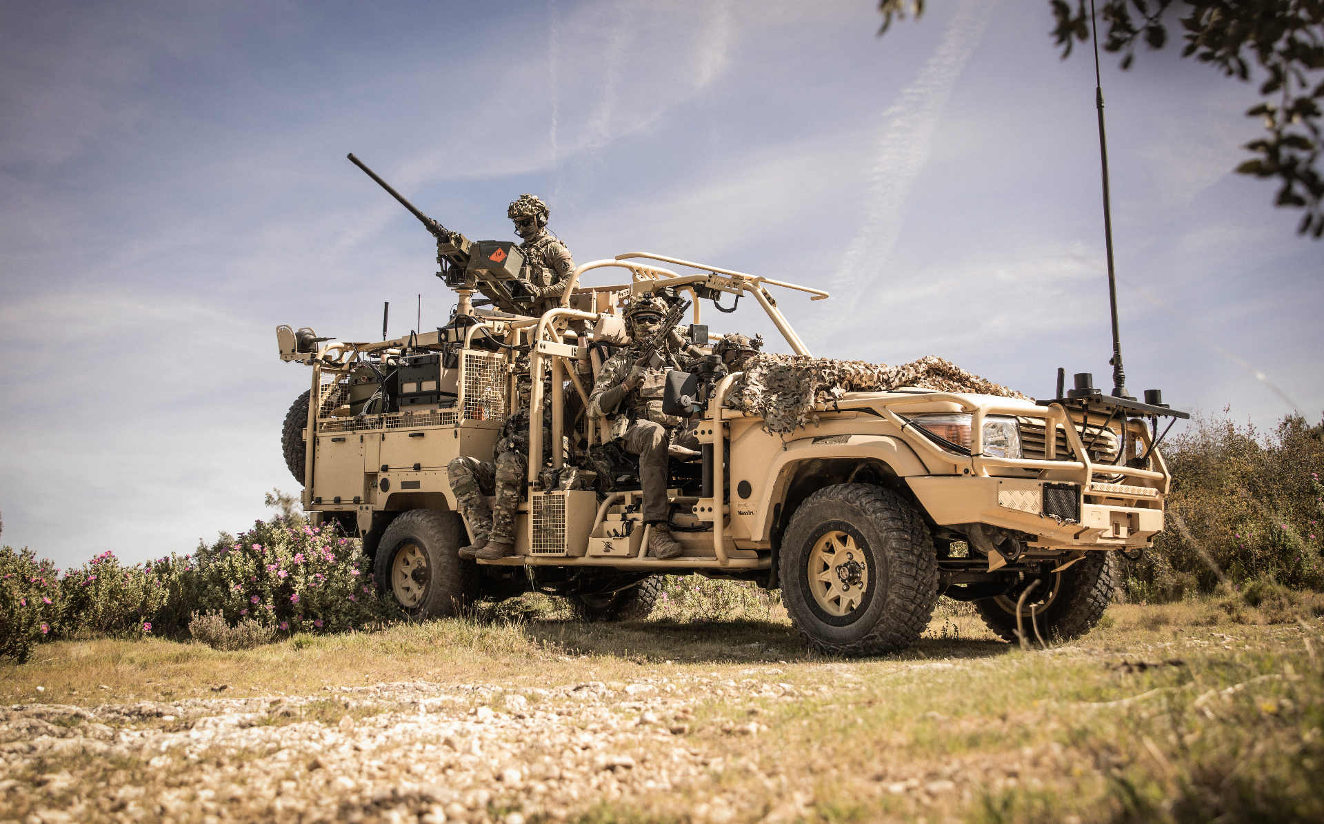 Tactical vehicle with operators in field